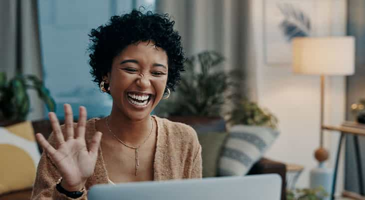 Woman takes part in a hybrid meeting by joining remotely